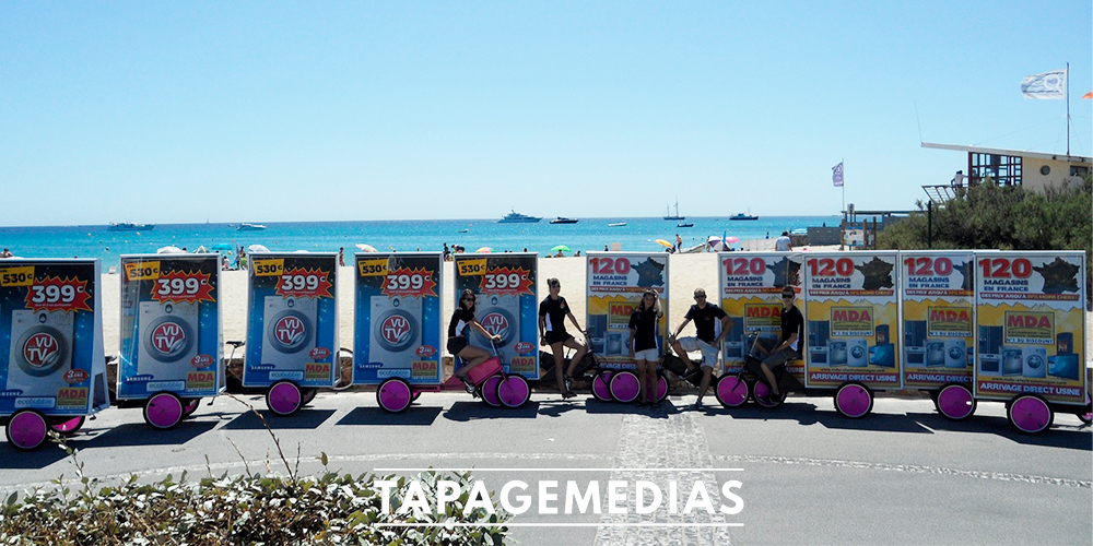 mda-velo-publicitaire-avec-hotes-et-hotesses-plages-de-pampelonne-tapage-medias